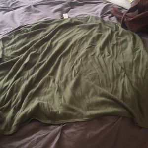 Olive green cape. Missing strap
